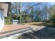 Deck and view of a fenced backyard with mature trees at 2105 Fellowship Rd, Tucker, GA 30084