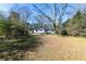Large backyard with home and trees at 2105 Fellowship Rd, Tucker, GA 30084