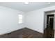 Spacious bedroom featuring hardwood floors and access to other rooms at 2105 Fellowship Rd, Tucker, GA 30084