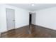 Spacious bedroom with hardwood floors and gray doors at 2105 Fellowship Rd, Tucker, GA 30084