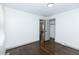 Bedroom with hardwood floors, closet, and access to other rooms at 2105 Fellowship Rd, Tucker, GA 30084