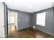 Spacious bedroom with gray walls and hardwood floors at 2105 Fellowship Rd, Tucker, GA 30084