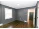 Cozy bedroom with dark gray walls and hardwood floors at 2105 Fellowship Rd, Tucker, GA 30084