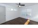 Bedroom with hardwood floors, window blinds, and ceiling fan at 2105 Fellowship Rd, Tucker, GA 30084