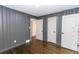 Spacious bedroom with gray walls and hardwood floors at 2105 Fellowship Rd, Tucker, GA 30084
