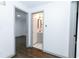 Hallway with dark hardwood floors and access to rooms at 2105 Fellowship Rd, Tucker, GA 30084