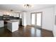 Open concept kitchen and dining area with hardwood floors at 2105 Fellowship Rd, Tucker, GA 30084