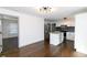 Modern kitchen with white cabinets, granite island, and dark tile backsplash at 2105 Fellowship Rd, Tucker, GA 30084