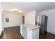 Eat-in kitchen with island, granite countertops and hardwood floors at 2105 Fellowship Rd, Tucker, GA 30084