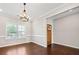 Bright dining room with hardwood floors and chandelier at 2144 Woodmarsh Cir, Auburn, GA 30011