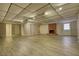 Ample basement space with laminate flooring and a brick fireplace at 3856 Woodyhill Dr, Lithonia, GA 30038