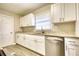 Updated kitchen featuring white cabinets, granite countertops, and stainless steel appliances at 3856 Woodyhill Dr, Lithonia, GA 30038