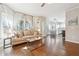 Inviting living room showcases hardwood floors and large windows allowing for natural light at 4620 Hardwick Ct, Suwanee, GA 30024