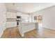 Modern kitchen with white cabinets, granite countertops, and island at 5547 Rosehall Pl, Atlanta, GA 30349