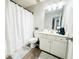 Bathroom features a white vanity, toilet, and shower at 320 Kentshire, Lawrenceville, GA 30044