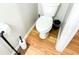 Small bathroom with toilet and hardwood floors at 320 Kentshire, Lawrenceville, GA 30044