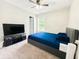Bright bedroom with a large bed, TV, and plenty of space at 320 Kentshire, Lawrenceville, GA 30044