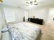 Primary bedroom featuring a king bed, dresser, and ceiling fan at 320 Kentshire, Lawrenceville, GA 30044