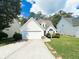 Charming house with a white exterior, a two-car garage, and a well-maintained lawn at 320 Kentshire, Lawrenceville, GA 30044
