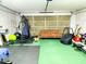 Functional garage gym with equipment and a sitting area at 320 Kentshire, Lawrenceville, GA 30044
