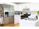 Modern kitchen with stainless steel appliances and white cabinetry at 320 Kentshire, Lawrenceville, GA 30044