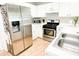 Modern kitchen with stainless steel appliances and white cabinetry at 320 Kentshire, Lawrenceville, GA 30044