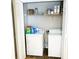 Laundry closet with washer, dryer, and shelving at 320 Kentshire, Lawrenceville, GA 30044