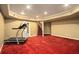 Finished basement featuring red carpet, recessed lighting, and a staircase leading to the upper level at 120 Fountain Oak, Villa Rica, GA 30180