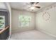 A spacious bedroom with a unique wall clock design and a scenic view from the large window at 120 Fountain Oak, Villa Rica, GA 30180