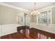Dining room with hardwood floors, chandelier, and decorative trim at 120 Fountain Oak, Villa Rica, GA 30180