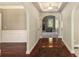 Inviting entryway with hardwood floors, arched doorways, and a view of the living room fireplace at 120 Fountain Oak, Villa Rica, GA 30180