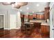 A kitchen featuring dark wood cabinets, granite countertops, stainless steel appliances and hardwood floors at 120 Fountain Oak, Villa Rica, GA 30180