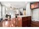 Bright kitchen with granite countertops, wood floors, and an island with bar seating at 120 Fountain Oak, Villa Rica, GA 30180