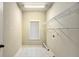 Functional laundry room with ample shelving and a window for natural light at 120 Fountain Oak, Villa Rica, GA 30180