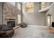Open living room featuring a stone fireplace at 120 Fountain Oak, Villa Rica, GA 30180