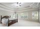 Spacious main bedroom with tray ceilings, carpet flooring, and three windows providing ample natural light at 120 Fountain Oak, Villa Rica, GA 30180