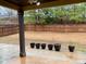 Covered patio extends to a large, grassy backyard enclosed by a wooden fence at 1370 Long Acre Dr, Loganville, GA 30052