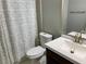 Bathroom with a white vanity, toilet, framed mirror, and shower with curtain at 1370 Long Acre Dr, Loganville, GA 30052