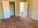 Bedroom with neutral carpet, two white paneled doors, neutral colored walls at 1370 Long Acre Dr, Loganville, GA 30052