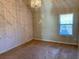 Bedroom with neutral carpet, neutral colored walls, decorative trim and a chandelier at 1370 Long Acre Dr, Loganville, GA 30052