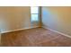 Bedroom with neutral carpet, neutral colored walls and a window with blinds at 1370 Long Acre Dr, Loganville, GA 30052