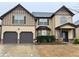 Charming two-story home with a two-car garage and a welcoming front porch at 1370 Long Acre Dr, Loganville, GA 30052