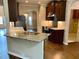 Kitchen featuring granite counters and stainless appliances, with a seamless transition to living areas at 1370 Long Acre Dr, Loganville, GA 30052