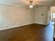 Open-concept living room showcasing beautiful hardwood floors and natural light at 1370 Long Acre Dr, Loganville, GA 30052
