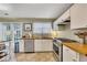 Updated kitchen featuring stainless steel appliances and wood countertops at 4206 Cornell Nw Xing, Kennesaw, GA 30144