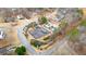 Aerial view showing tennis court and pool at 65 Centerport Dr, White, GA 30184