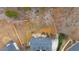 Aerial view of house and surrounding wooded area at 65 Centerport Dr, White, GA 30184