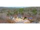 House nestled in wooded area with a cul-de-sac at 65 Centerport Dr, White, GA 30184
