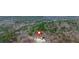 Aerial view of house with wooded lot at 65 Centerport Dr, White, GA 30184
