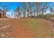 Backyard with stone pathway and wooden deck at 65 Centerport Dr, White, GA 30184